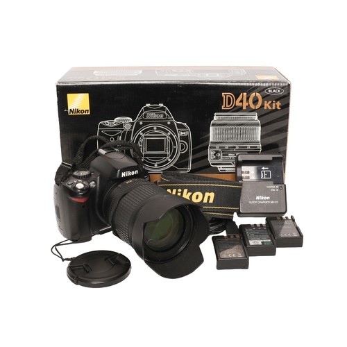 131 - Nikon D40 Body and Lens. Includes:
D40 Body
Nikkor AF-S 18-105mm f3.5-5.6 ED
Untested. SD card door ... 