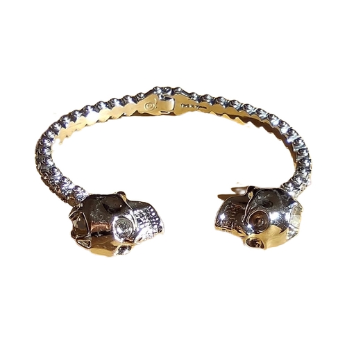 181 - Alexander McQueen Double Skull Jewel Encrusted Hinged Bangle. In original box and in lovely conditio... 