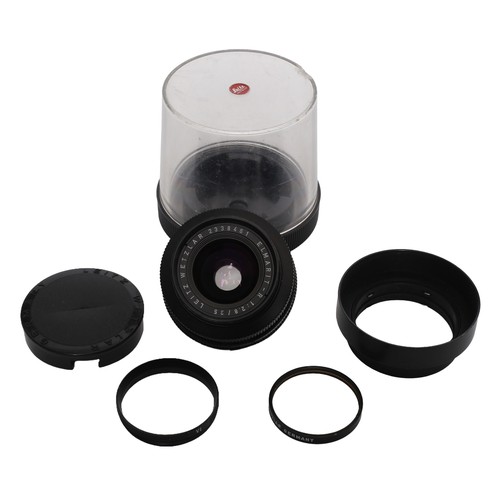 19 - Two Leica R Lenses. Includes:
Elmarit-R 35mm f2.8 lens (no. 2338461). Complete with Series VI UV fil... 