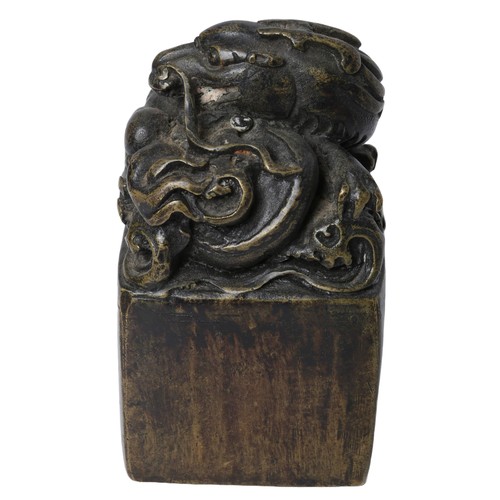 117 - Bronzed Chinese Dragon Seal. Approx. 12cm tall by 6cm wide.