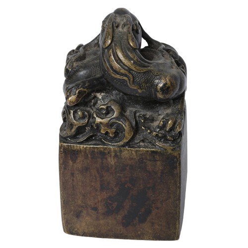 117 - Bronzed Chinese Dragon Seal. Approx. 12cm tall by 6cm wide.