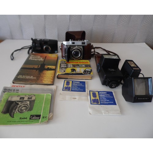 34 - Kodak Retina II C CAMERA AND OLYMPUS 00M 115 plus accessories. Kodak manual included. Please see the... 