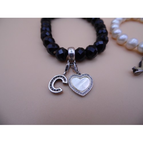 42 - 3 Thomas Sabo 925 silver marked bracelet with charms.