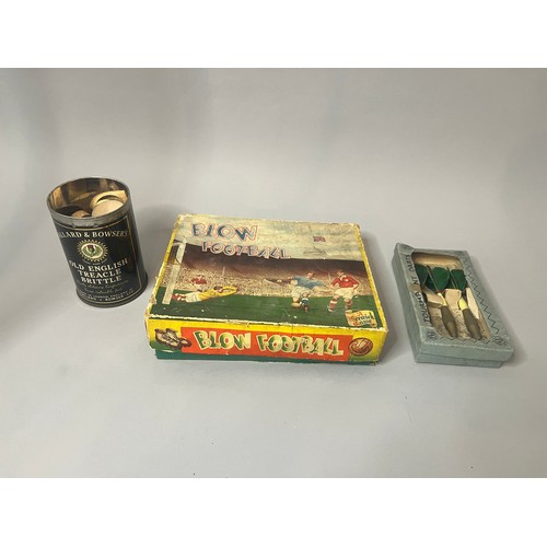 94 - A vintage Blow Football game, presented in a worn cardboard box featuring mid-20th-century style ill... 