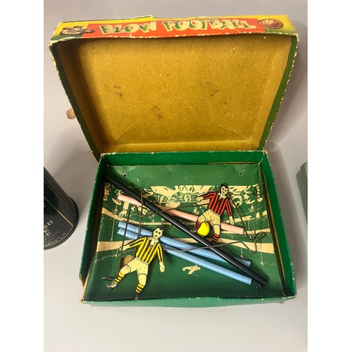 94 - A vintage Blow Football game, presented in a worn cardboard box featuring mid-20th-century style ill... 
