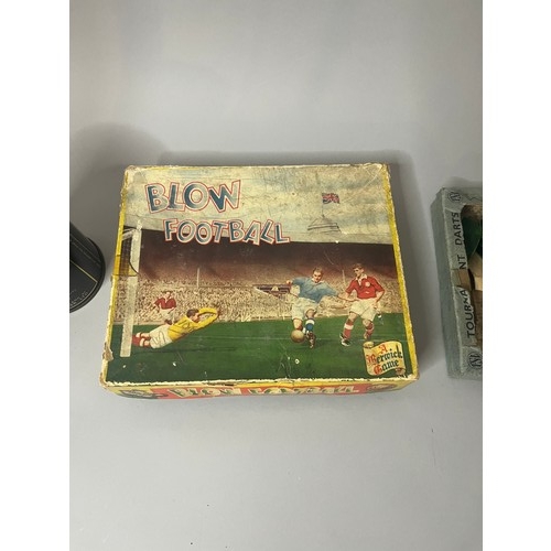 94 - A vintage Blow Football game, presented in a worn cardboard box featuring mid-20th-century style ill... 