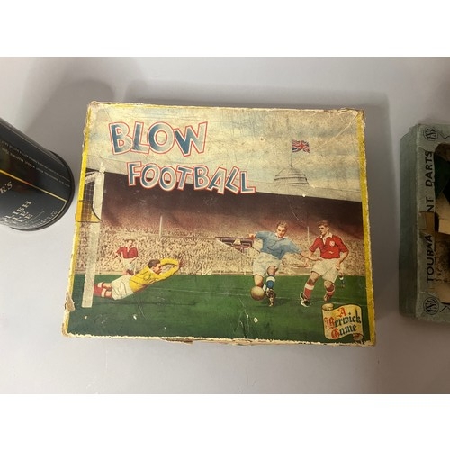 94 - A vintage Blow Football game, presented in a worn cardboard box featuring mid-20th-century style ill... 
