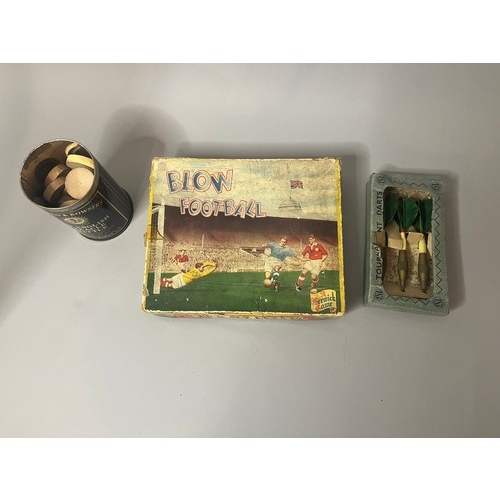 94 - A vintage Blow Football game, presented in a worn cardboard box featuring mid-20th-century style ill... 