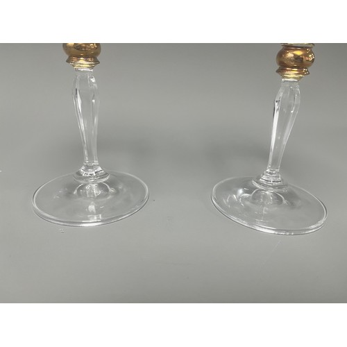 4 - A Pair of Crystal Clear Sara Gold Stem Wine Glasses. A pair of clear crystal wine glasses, likely Sa... 