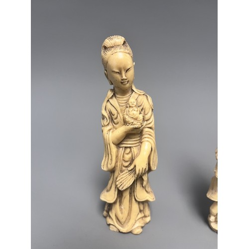 10 - A Pair of Creamy-White Carved Figurines Male and Female. A pair of creamy-white carved figurines, de... 