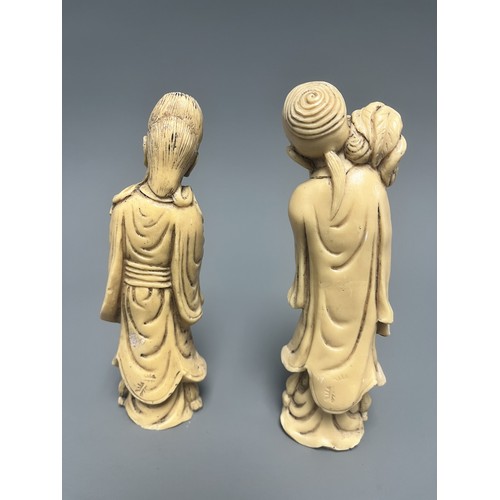 10 - A Pair of Creamy-White Carved Figurines Male and Female. A pair of creamy-white carved figurines, de... 