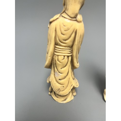10 - A Pair of Creamy-White Carved Figurines Male and Female. A pair of creamy-white carved figurines, de... 