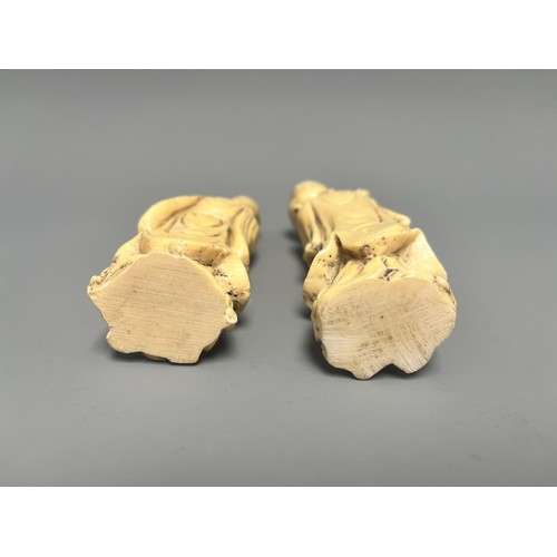 10 - A Pair of Creamy-White Carved Figurines Male and Female. A pair of creamy-white carved figurines, de... 