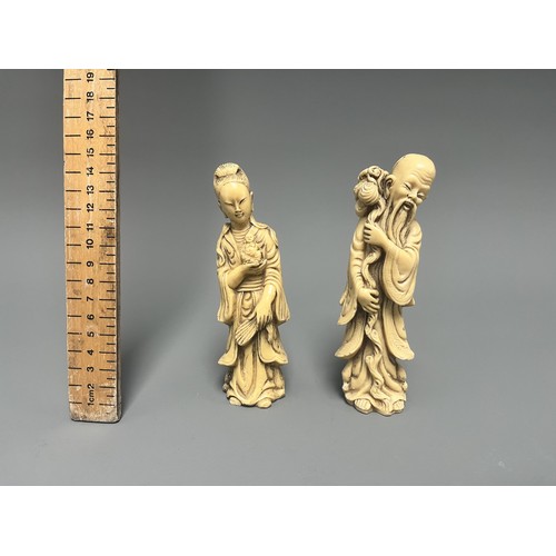 10 - A Pair of Creamy-White Carved Figurines Male and Female. A pair of creamy-white carved figurines, de... 