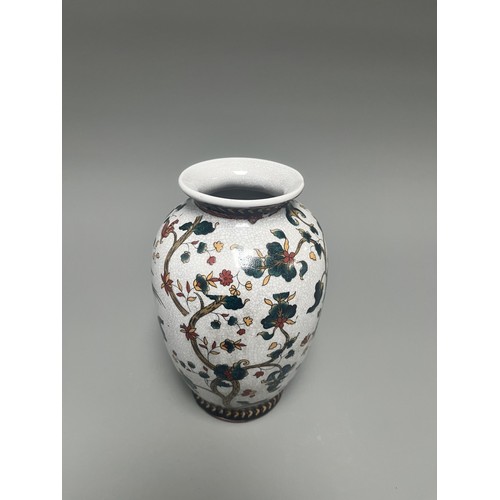 11 - Chinese Crackle Glaze Ceramic Vase Flowering Branches Birds. A white crackle-glazed ceramic vase, de... 