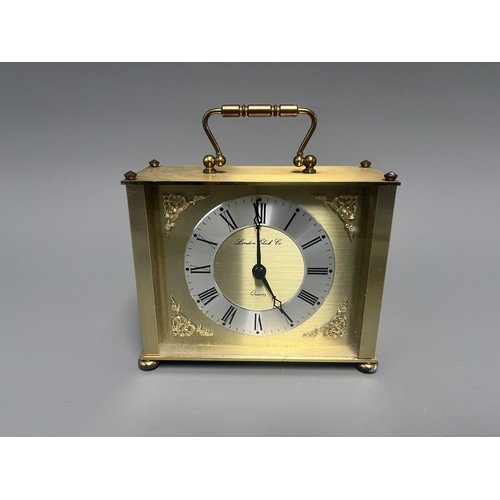 12 - London Clock Co. Gold Toned Quartz Carriage Clock. A single gold-toned brass carriage clock by Londo... 