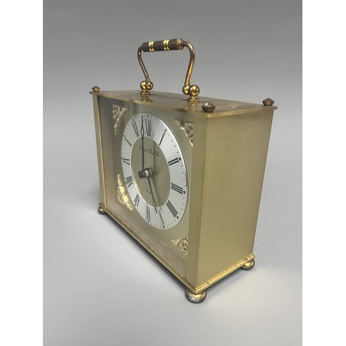12 - London Clock Co. Gold Toned Quartz Carriage Clock. A single gold-toned brass carriage clock by Londo... 