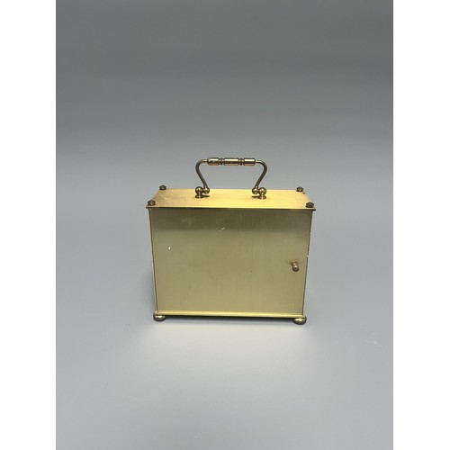 12 - London Clock Co. Gold Toned Quartz Carriage Clock. A single gold-toned brass carriage clock by Londo... 