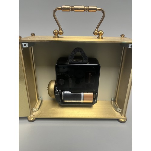 12 - London Clock Co. Gold Toned Quartz Carriage Clock. A single gold-toned brass carriage clock by Londo... 