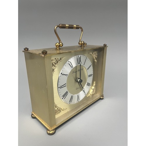 12 - London Clock Co. Gold Toned Quartz Carriage Clock. A single gold-toned brass carriage clock by Londo... 