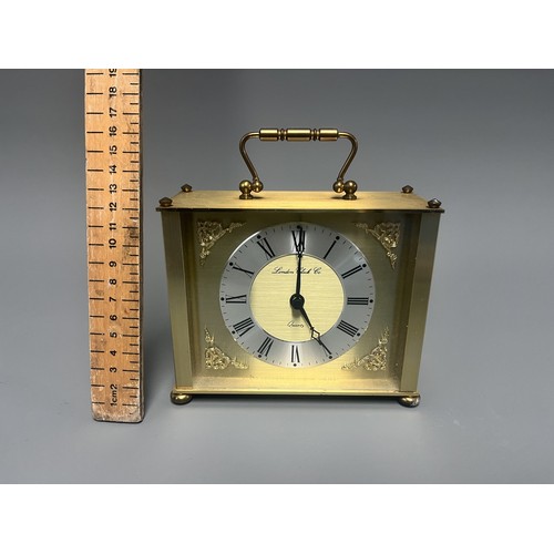 12 - London Clock Co. Gold Toned Quartz Carriage Clock. A single gold-toned brass carriage clock by Londo... 