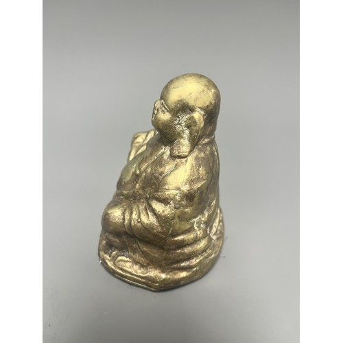 14 - Gold-Toned Tarnished Metal Happy Buddha Budai Figurine. A single gold-toned tarnished metal figurine... 