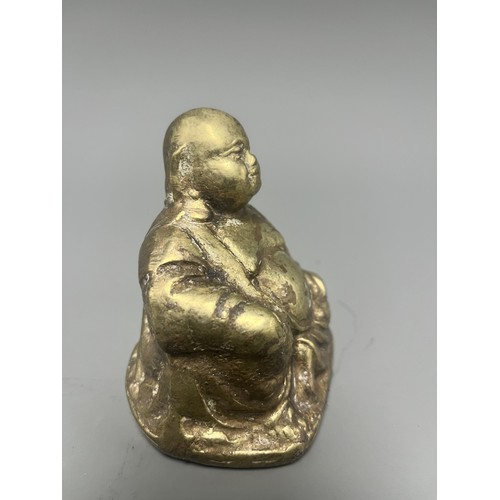 14 - Gold-Toned Tarnished Metal Happy Buddha Budai Figurine. A single gold-toned tarnished metal figurine... 