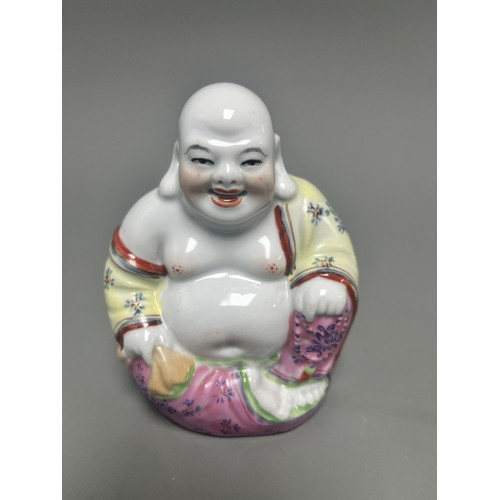 15 - Collection of East Asian Figurines including Porcelain Buddha etc. East Asian figurines including a ... 