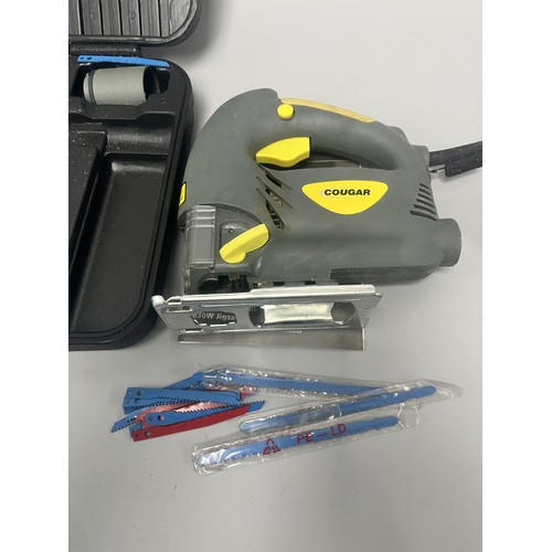 20 - COUGAR 630W Jigsaw Model CGCD24H-PJ630L and Accessories. A Collection of items including a grey and ... 