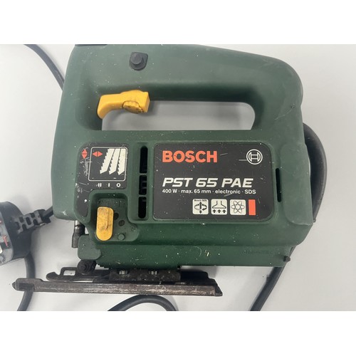 18 - Bosch PST 65 PAE Electronic SDS Jigsaw 400 W.
A single dark green and yellow Bosch PST 65 PAE electr... 