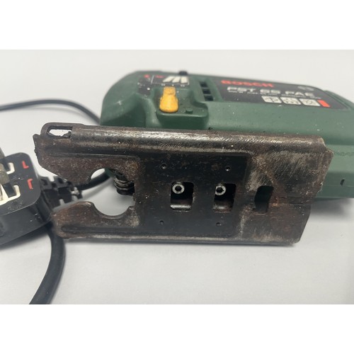18 - Bosch PST 65 PAE Electronic SDS Jigsaw 400 W.
A single dark green and yellow Bosch PST 65 PAE electr... 