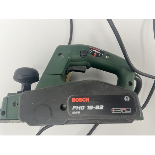 19 - Bosch PHO 15-82 Electric Hand Planer 500W.
A green and black Bosch electric hand planer, model PHO 1... 