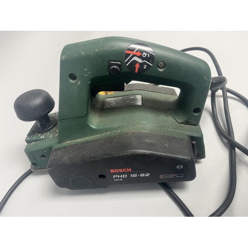 19 - Bosch PHO 15-82 Electric Hand Planer 500W.
A green and black Bosch electric hand planer, model PHO 1... 