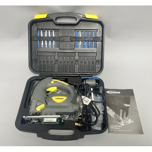 20 - COUGAR 630W Jigsaw Model CGCD24H-PJ630L and Accessories. A Collection of items including a grey and ... 