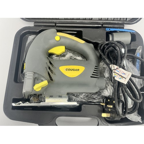 20 - COUGAR 630W Jigsaw Model CGCD24H-PJ630L and Accessories. A Collection of items including a grey and ... 