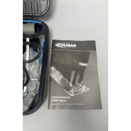 20 - COUGAR 630W Jigsaw Model CGCD24H-PJ630L and Accessories. A Collection of items including a grey and ... 