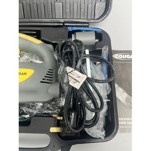20 - COUGAR 630W Jigsaw Model CGCD24H-PJ630L and Accessories. A Collection of items including a grey and ... 