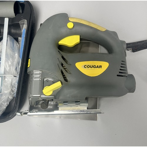20 - COUGAR 630W Jigsaw Model CGCD24H-PJ630L and Accessories. A Collection of items including a grey and ... 