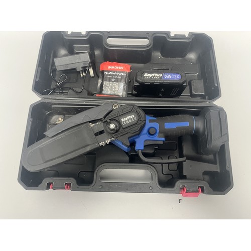 21 - DayPlus Mini Electric Chainsaw Kit with 21V Battery and Case. A DayPlus black and blue mini electric... 