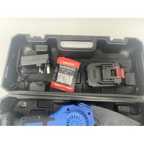 21 - DayPlus Mini Electric Chainsaw Kit with 21V Battery and Case. A DayPlus black and blue mini electric... 