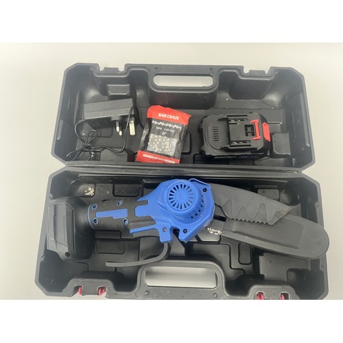21 - DayPlus Mini Electric Chainsaw Kit with 21V Battery and Case. A DayPlus black and blue mini electric... 