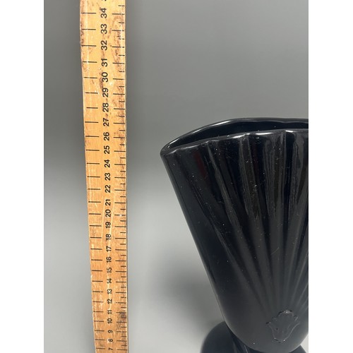 23 - Royal Haeger Art Deco Black Glass Fan Vase.
A single Art Deco-style footed vase attributed to Royal ... 