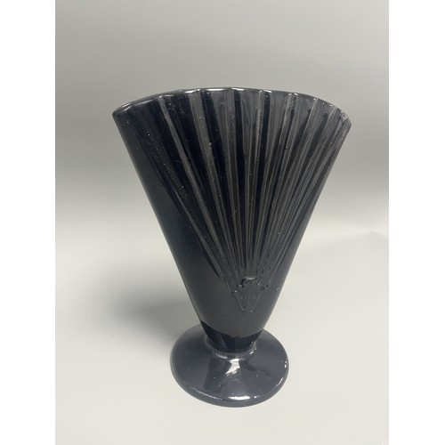 23 - Royal Haeger Art Deco Black Glass Fan Vase.
A single Art Deco-style footed vase attributed to Royal ... 