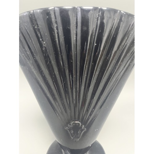 23 - Royal Haeger Art Deco Black Glass Fan Vase.
A single Art Deco-style footed vase attributed to Royal ... 