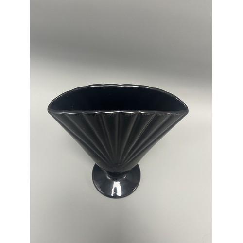23 - Royal Haeger Art Deco Black Glass Fan Vase.
A single Art Deco-style footed vase attributed to Royal ... 