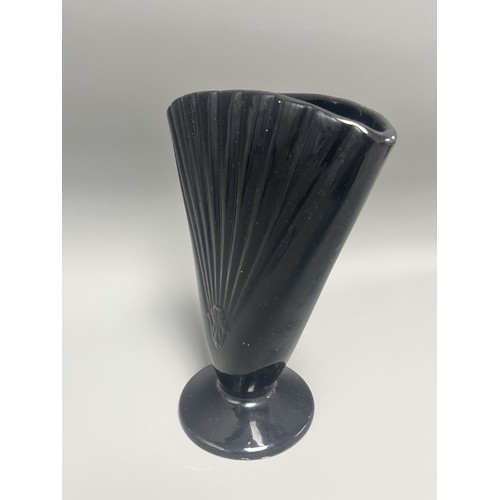 23 - Royal Haeger Art Deco Black Glass Fan Vase.
A single Art Deco-style footed vase attributed to Royal ... 