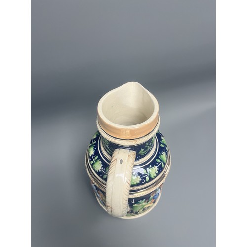 25 - A Large Historicist Polychrome Earthenware Ewer or Jug, Late 19th/Early 20th Century
A single histor... 