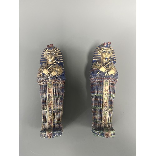 29 - A Pair of Egyptian Revival Painted Resin Anthropoid Sarcophagus Boxes. A pair of modern decorative l... 