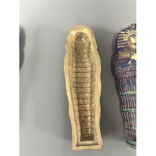 29 - A Pair of Egyptian Revival Painted Resin Anthropoid Sarcophagus Boxes. A pair of modern decorative l... 