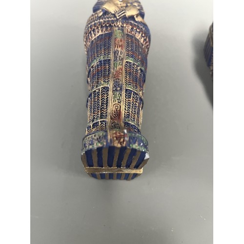 29 - A Pair of Egyptian Revival Painted Resin Anthropoid Sarcophagus Boxes. A pair of modern decorative l... 